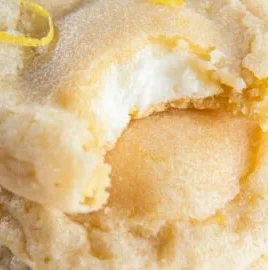 Lemon cheesecake cookies with a golden crust and lemon zest topping
