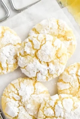 Lemon Crinkle Cookies with powdered sugar on a plate