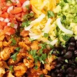 Low calorie chicken burrito bowl with fresh toppings and ingredients