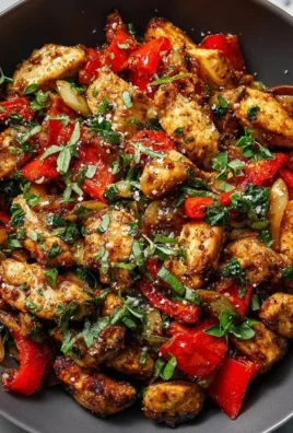 Colorful Mediterranean chicken stir fry with fresh vegetables and herbs