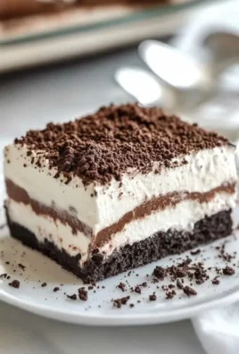 Delicious No Bake Oreo Lasagna Dessert with layers of cream and cookies