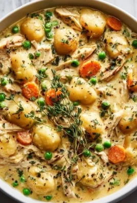 One Pot Gnocchi Chicken Pot Pie with chicken, vegetables, and gnocchi in a creamy sauce.
