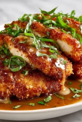 Delicious Parmesan Crusted Chicken ready to serve on a plate