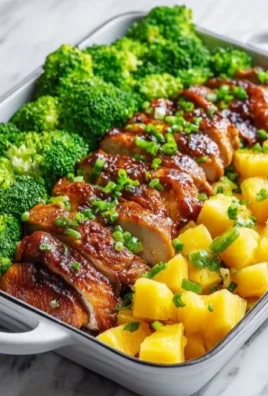 Pineapple Chicken Sheet Pan Meal with colorful vegetables and glaze
