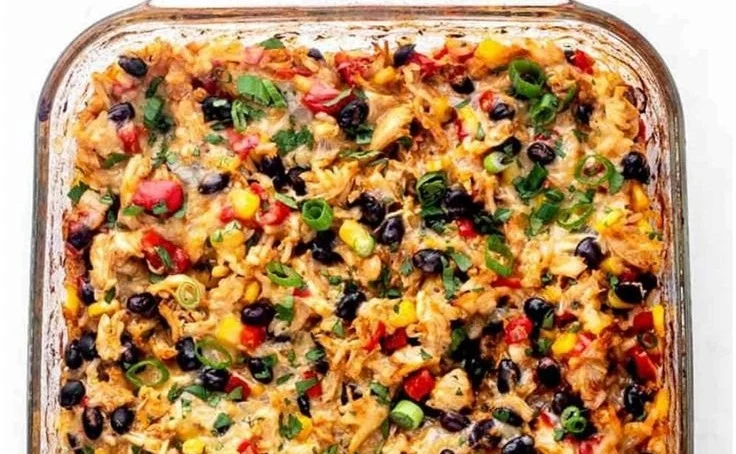 Delicious Protein Burrito Casserole topped with cheese and spices