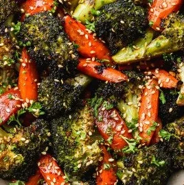 A serving of roasted broccoli and carrots, a healthy side dish.