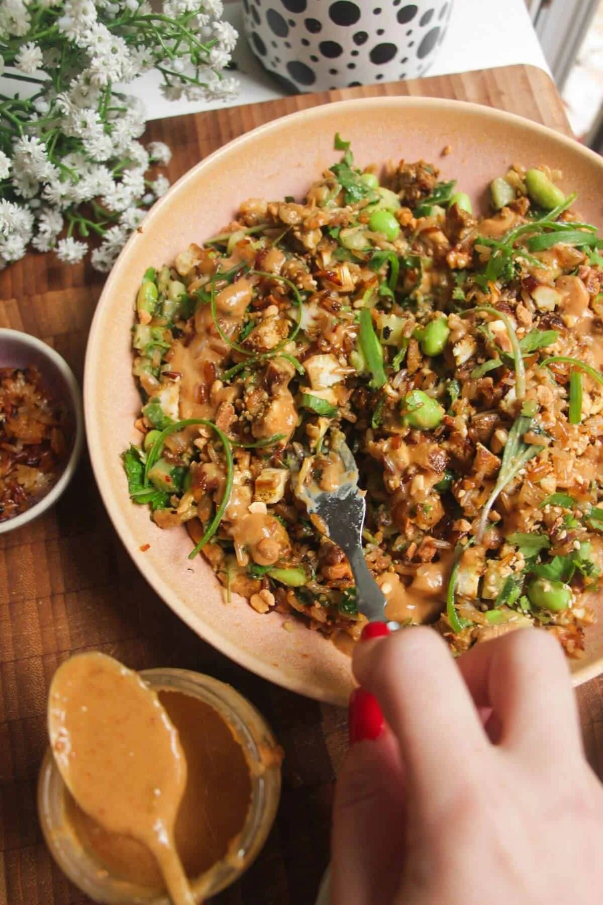 Delicious Satay Rice Salad with crispy rice and fresh vegetables