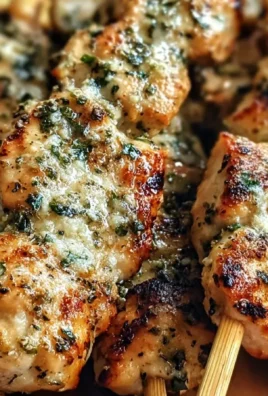 Delicious garlic parmesan chicken skewers ready for grilling in summer.