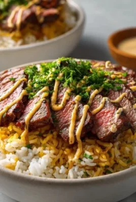 Delicious Steak Bowl with tender steak, colorful vegetables, and flavorful sauce.