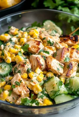 Creamy cucumber chicken salad with street corn served in a bowl