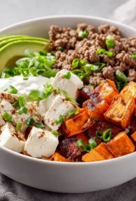 Delicious Sweet Potato and Ground Beef Bowl topped with fresh ingredients