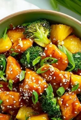Teriyaki chicken with pineapple and broccoli on a sheet pan ready to serve