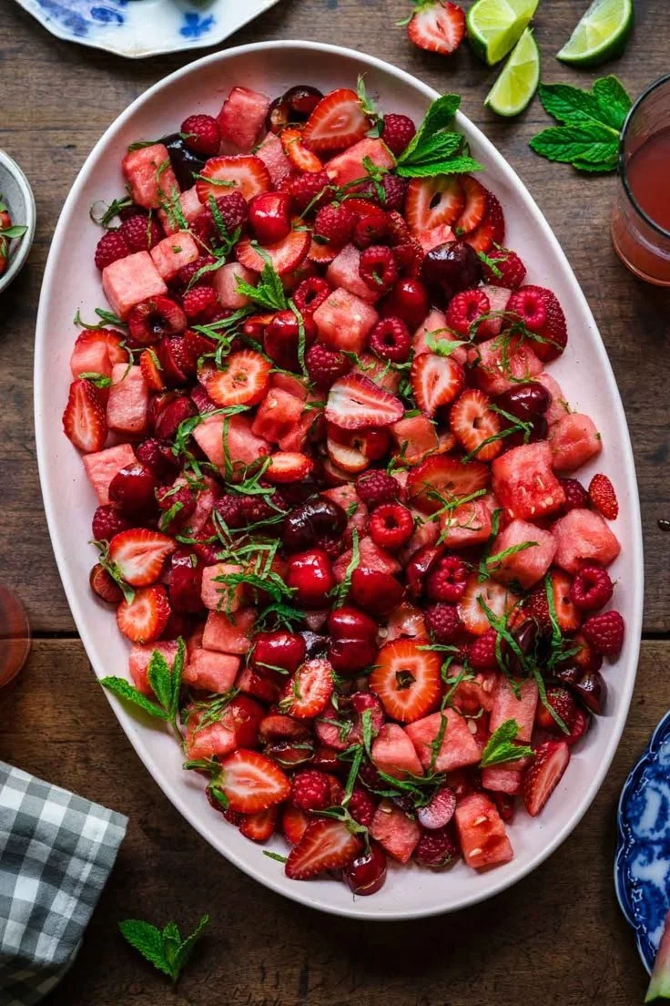 Colorful watermelon salad with mixed fruits served in a bowl